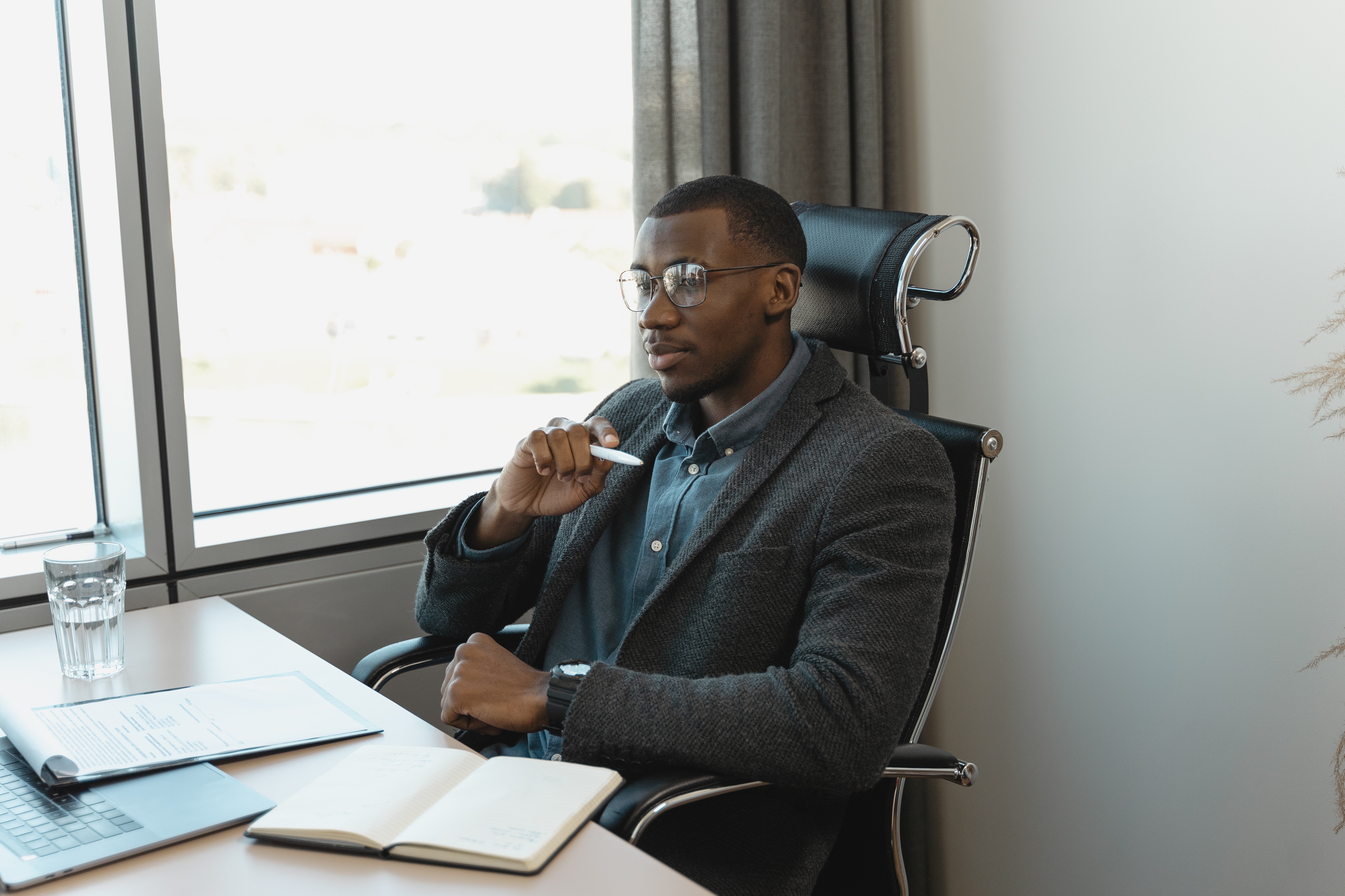 Founder sitting at a desk considering what assessing cultural fit would do for his team